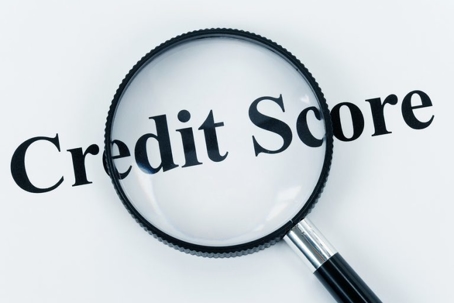 Credit Score and Magnifying glass