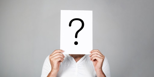 Man holding question mark